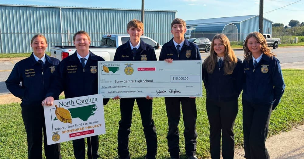FFA students pose with check from NC FFA