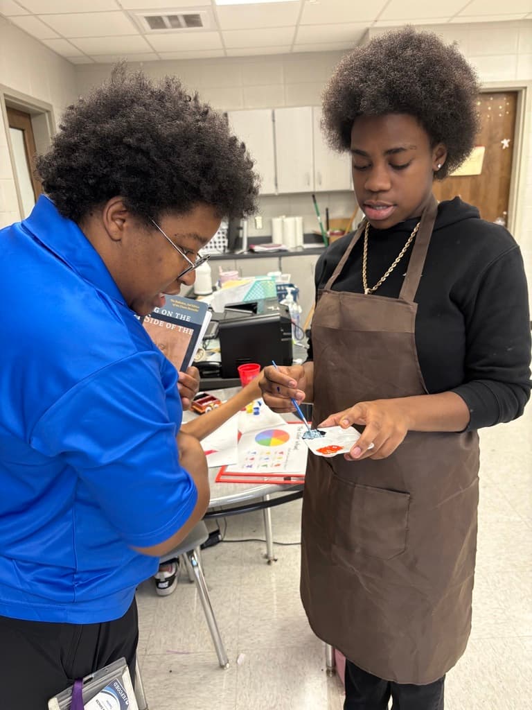 Ms. Dancer teaching art
