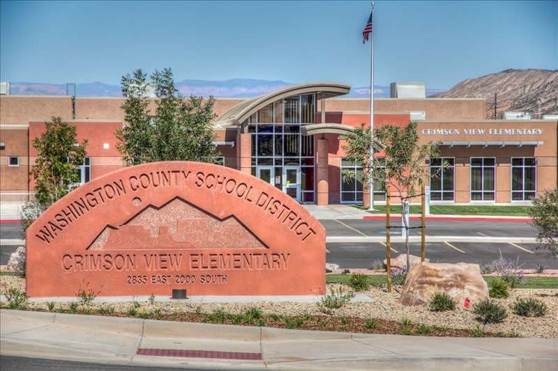 Crimson View building picture. Front of building with rock sign out front.