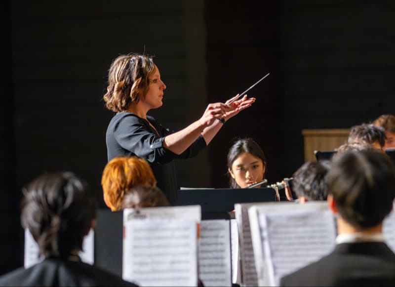 Fine Arts Programs, Teacher leads orchestra