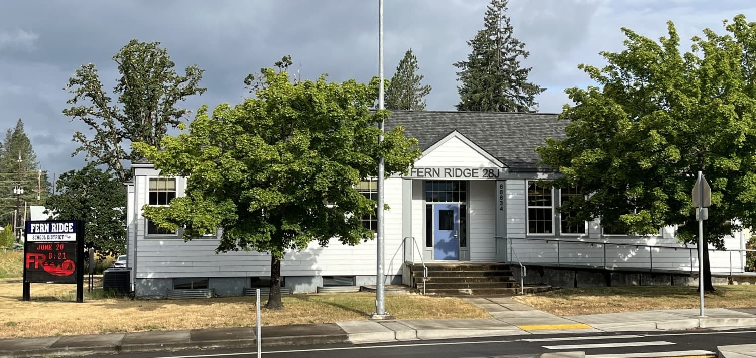 district office, grey building with blue door