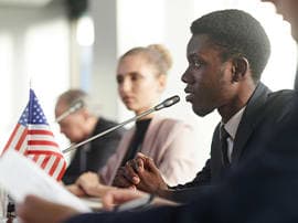 Student speaking into a microphone