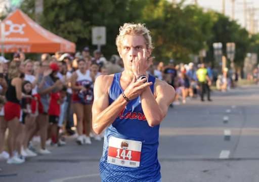 Picture of a cross-country runner holding up his watch