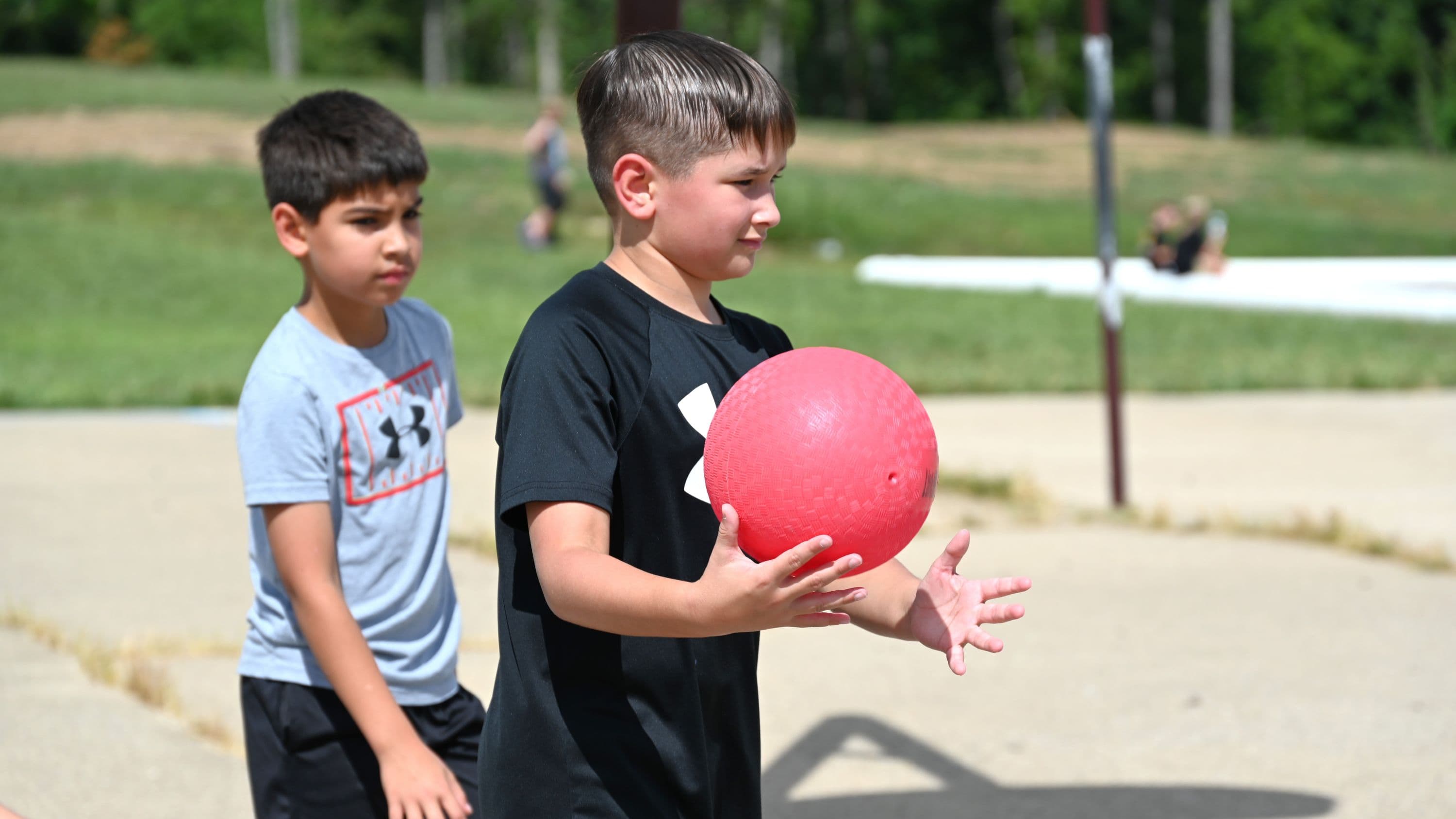 A student playing basketball.