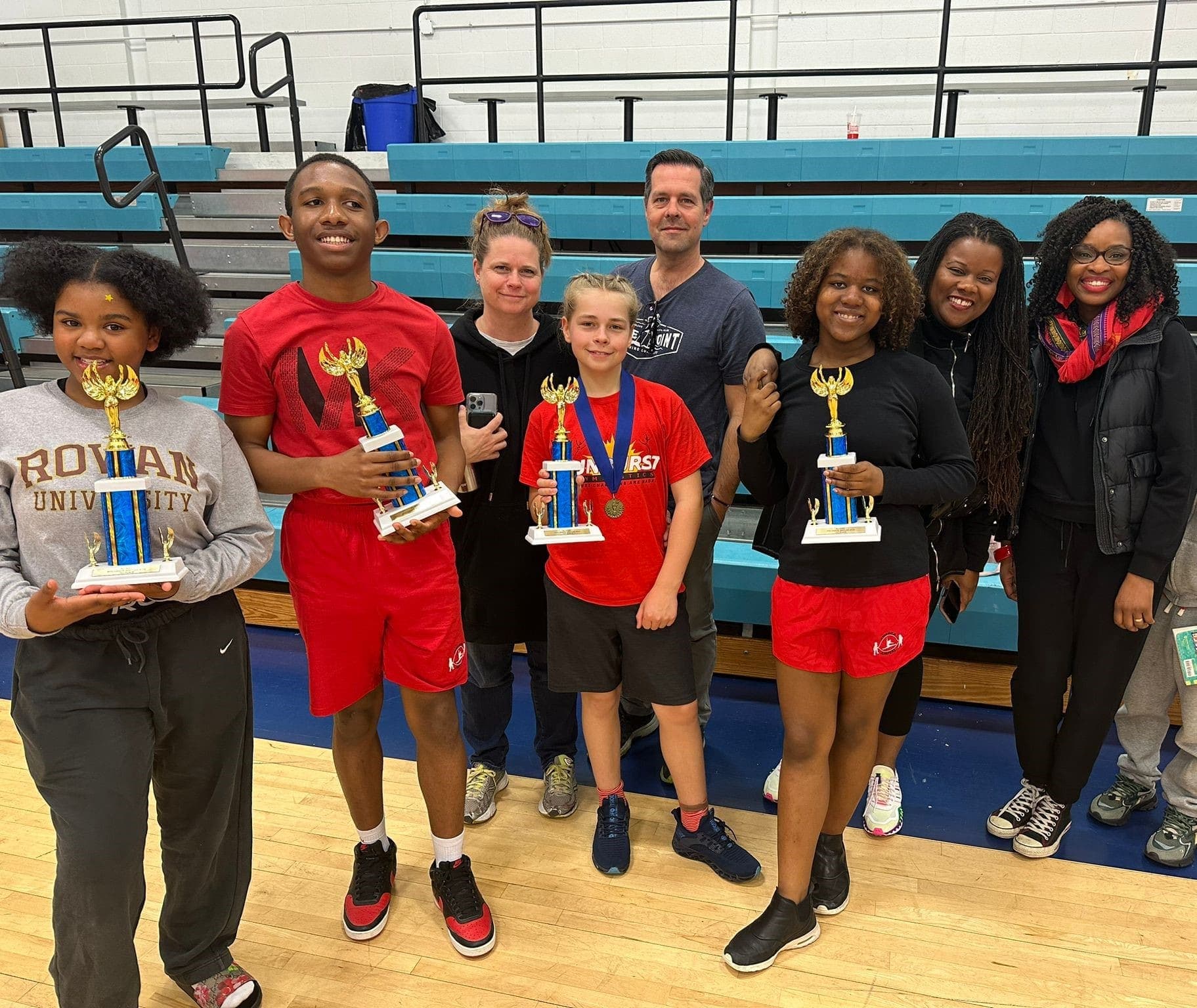Students smile with trophy