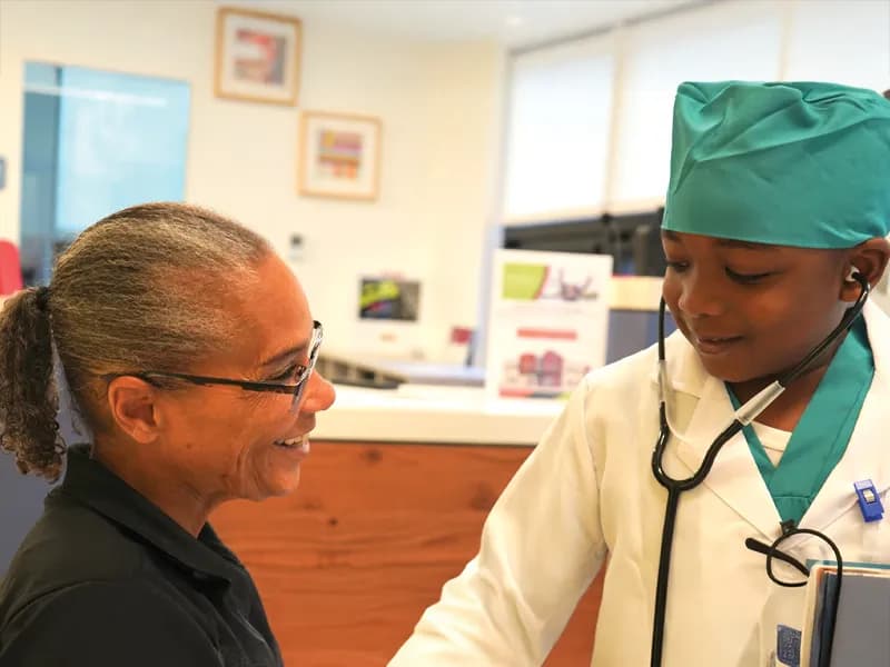 Child dressed as doctor with stethoscope
