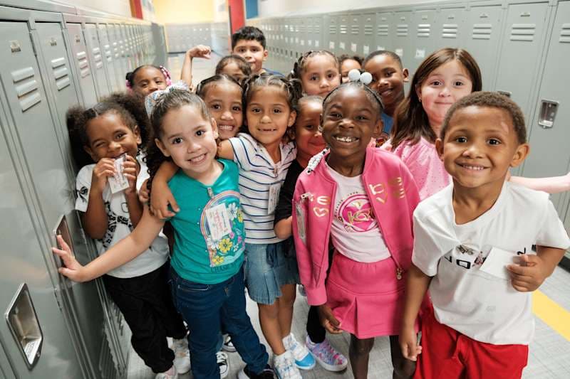 students walk down the hall on the first day