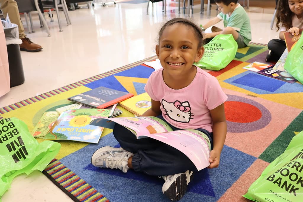 girl with her Bernie's Book Bank books
