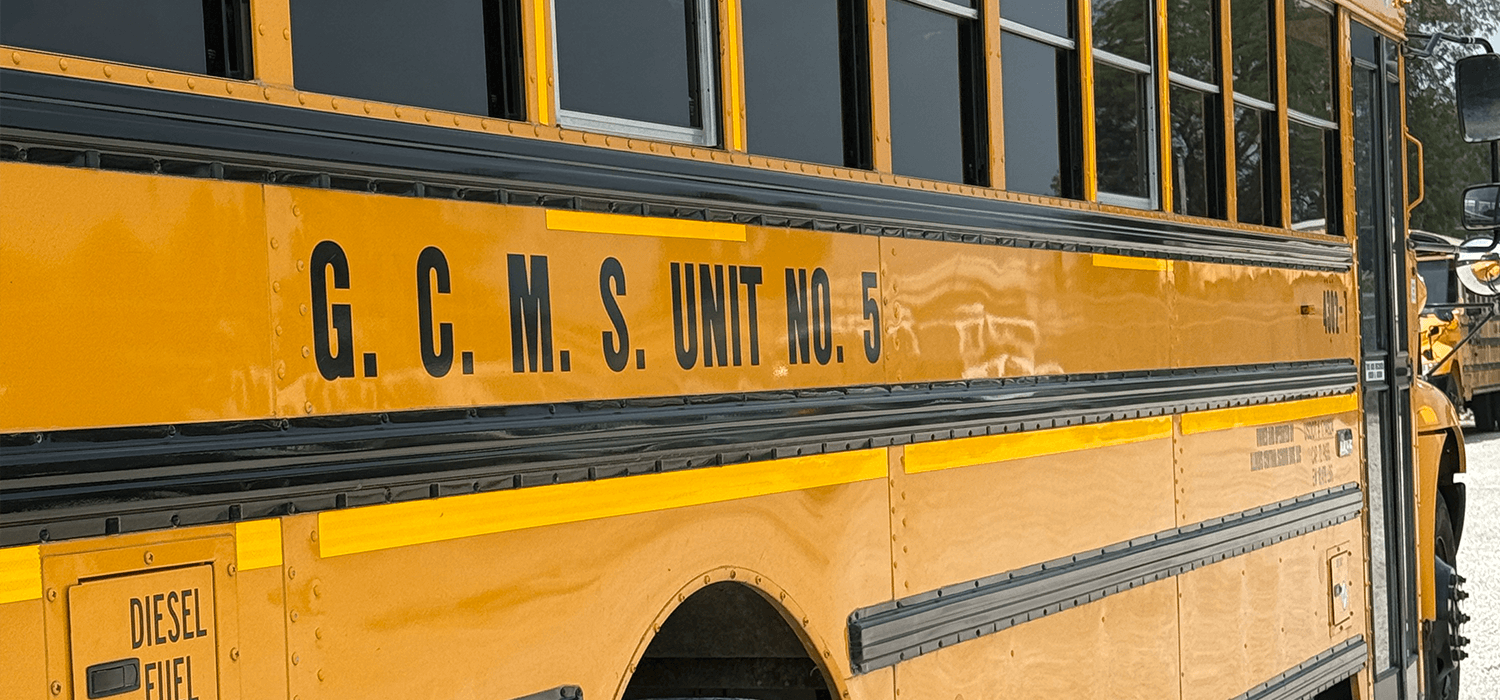 Side view of a GCMS school bus