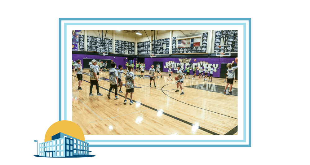 students playing basketball in the cedar valley middle school gym