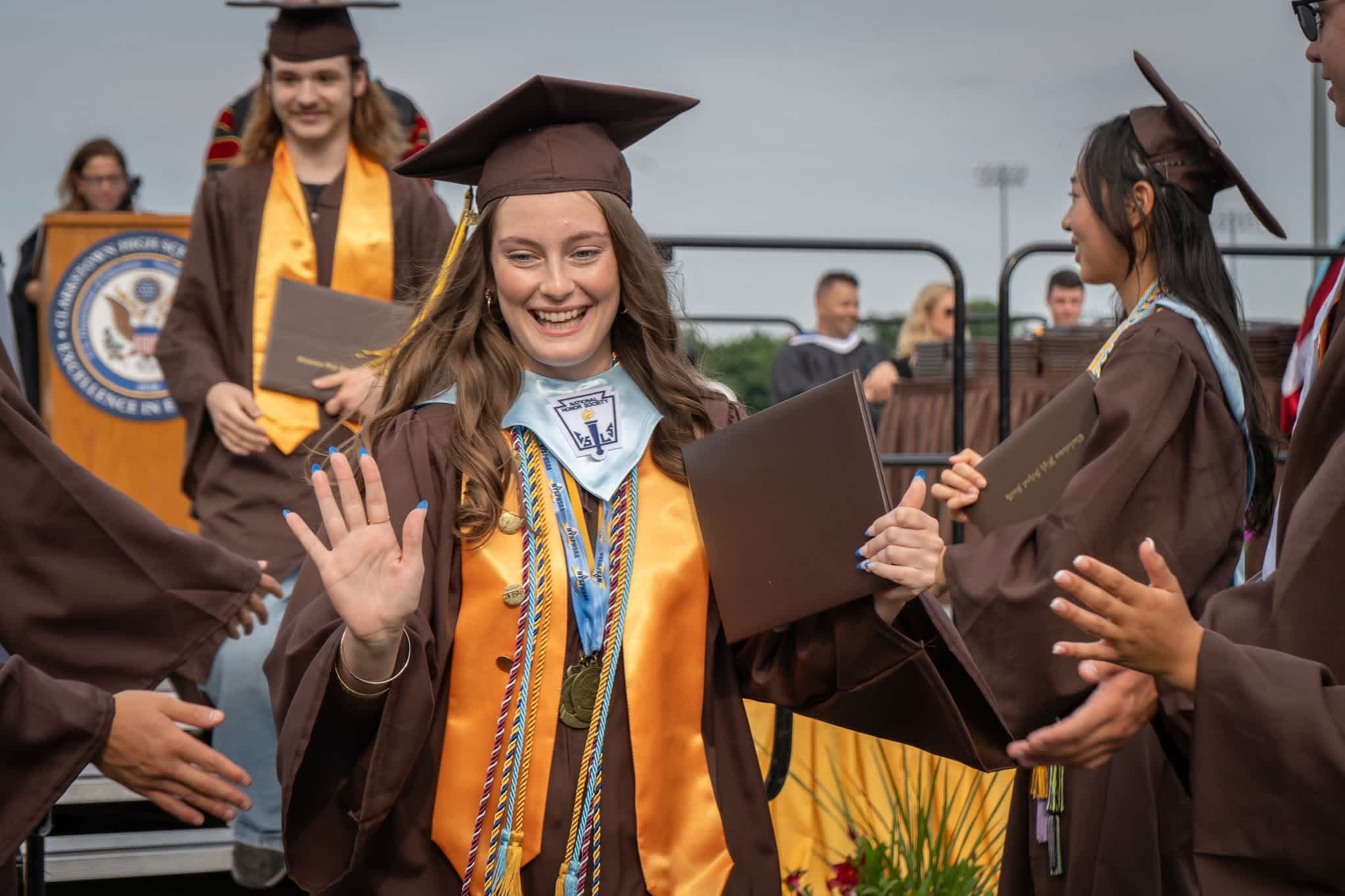CHSS student walking during commencement