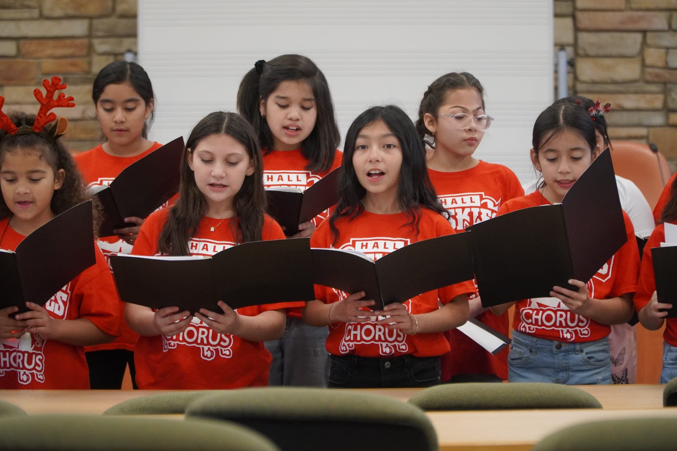 Hall students singing on stage