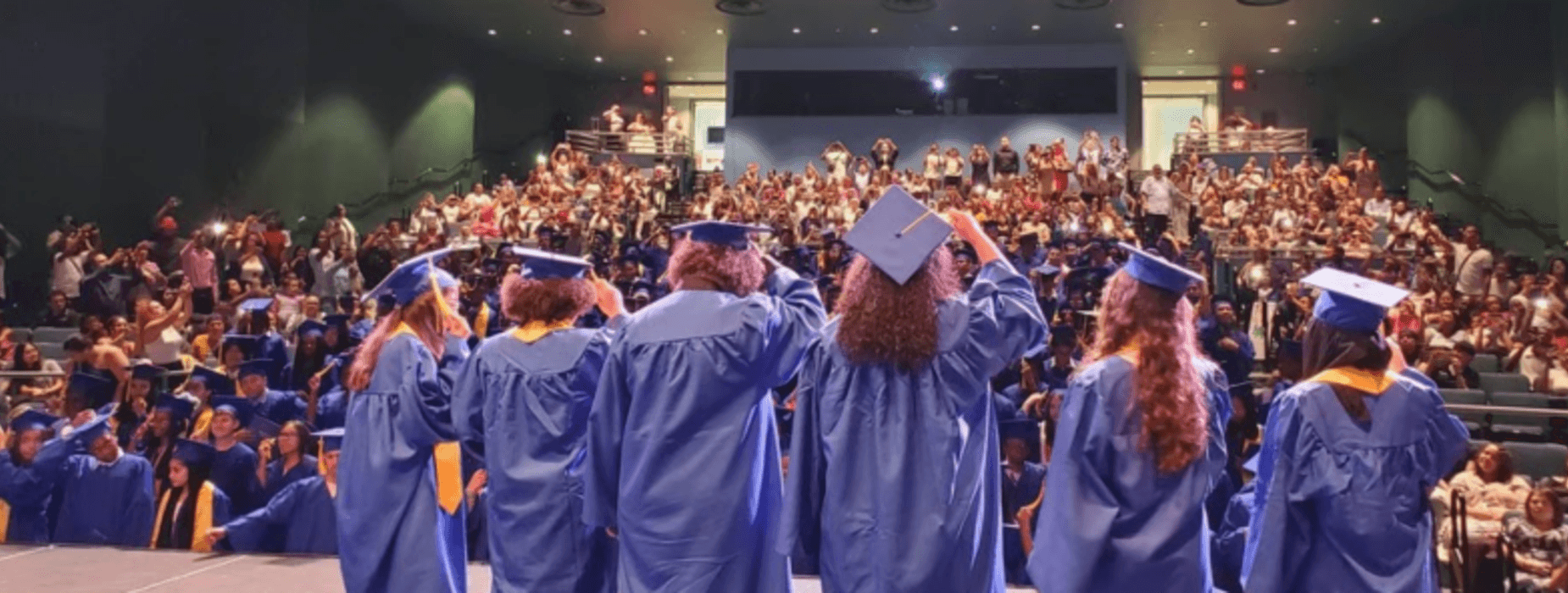 Six students wearing their cap and gowns