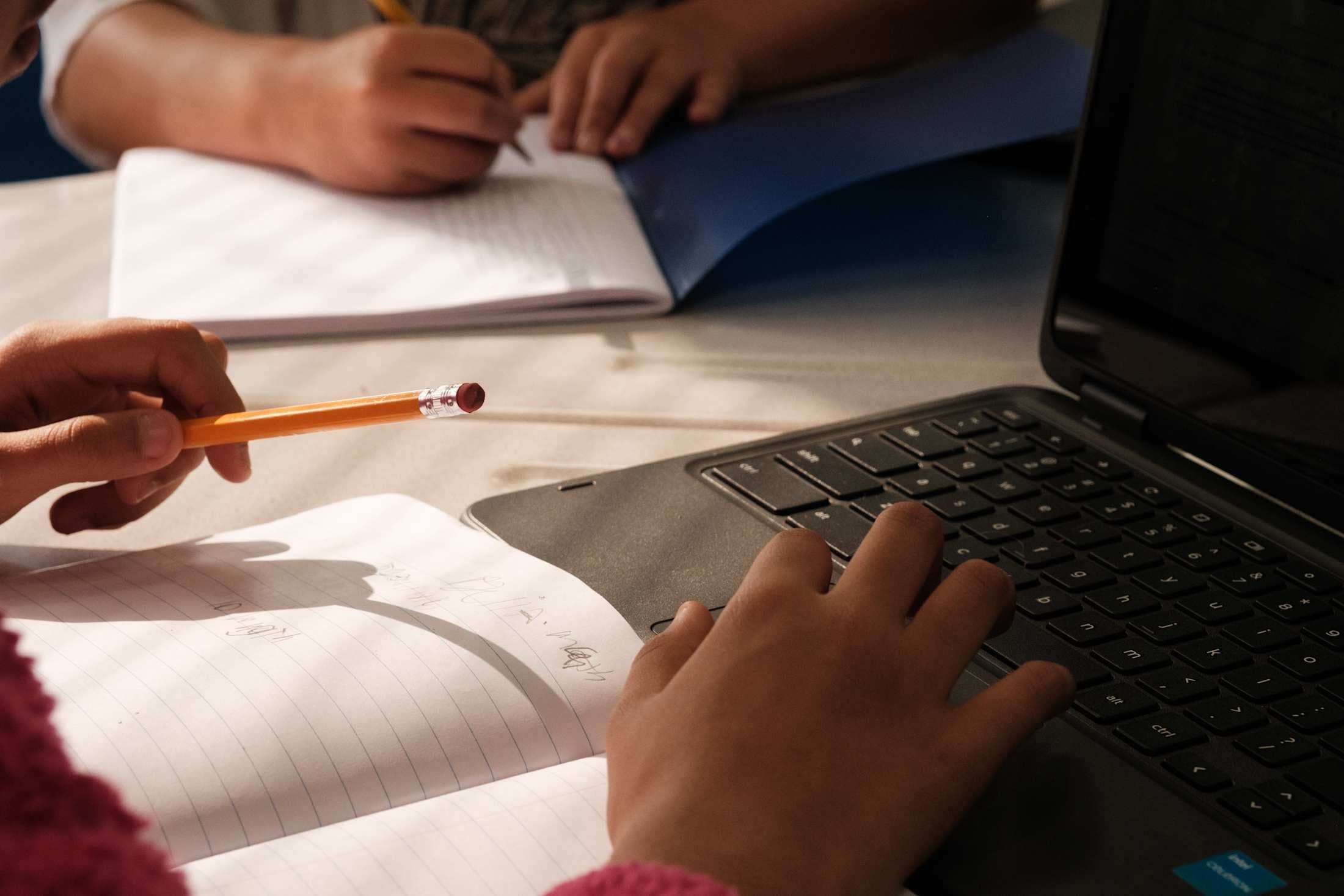 closeup of a desk with students working