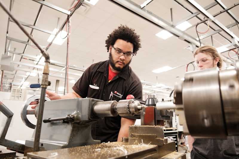 a student works with equipment at Tulsa Tech