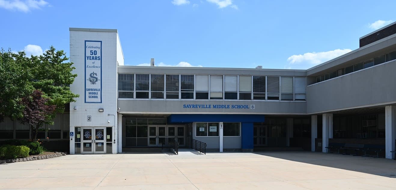 front of the school with trees