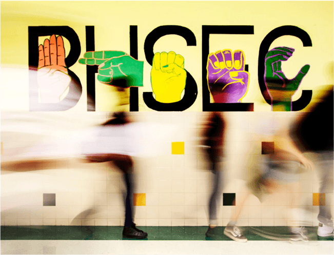 BHSEC with hands signing each letter with blurred movement in the background