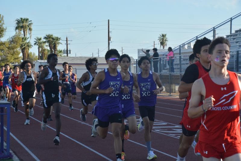 Photo showing Washington High School cross country runners competing against other schools