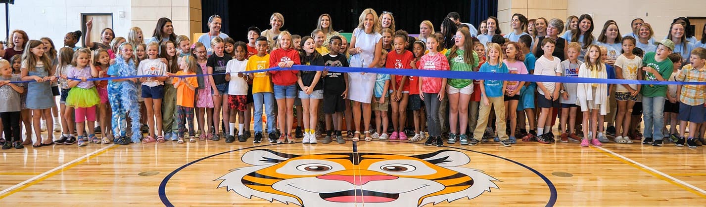 Ribbon cutting with staff and students