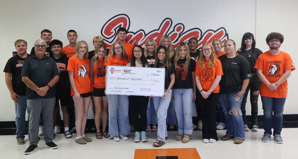 Jeff Rogers presents a grant to the Seniors in the ACHS Photojournalism class.