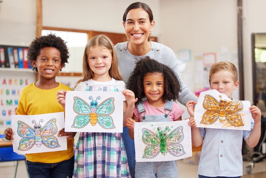 children showing off drawings