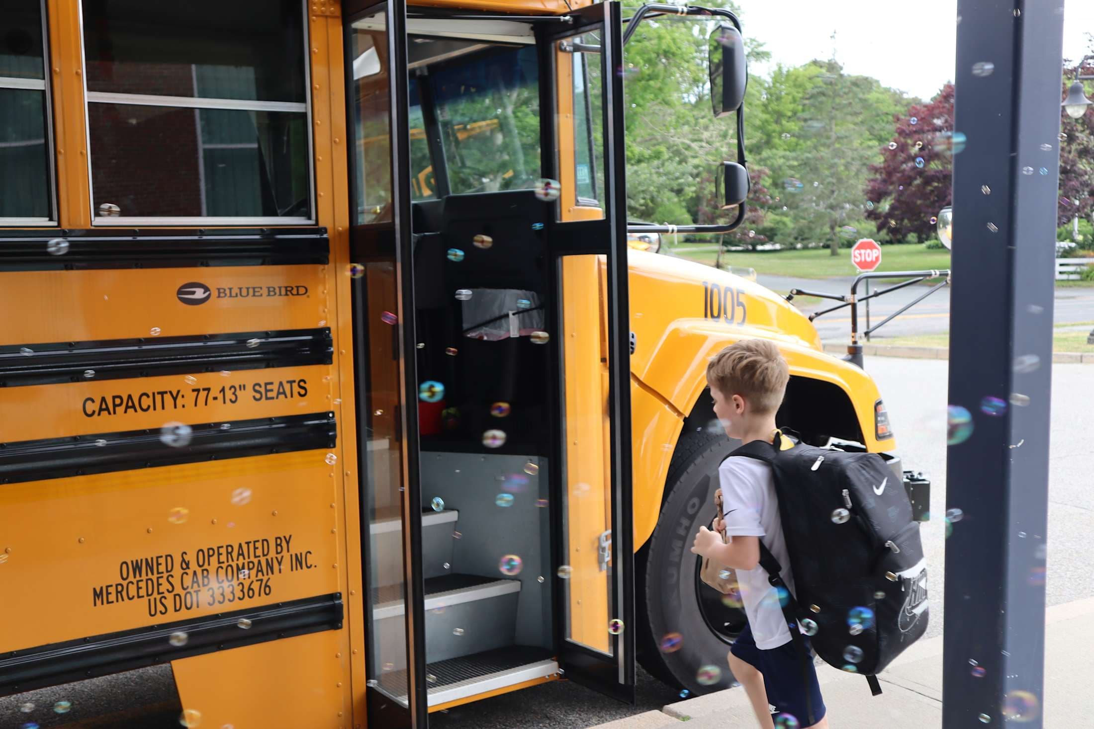 Student getting on the bus