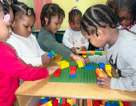 Children playing lego blocks