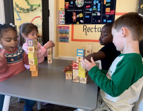 Children playing cube blocks