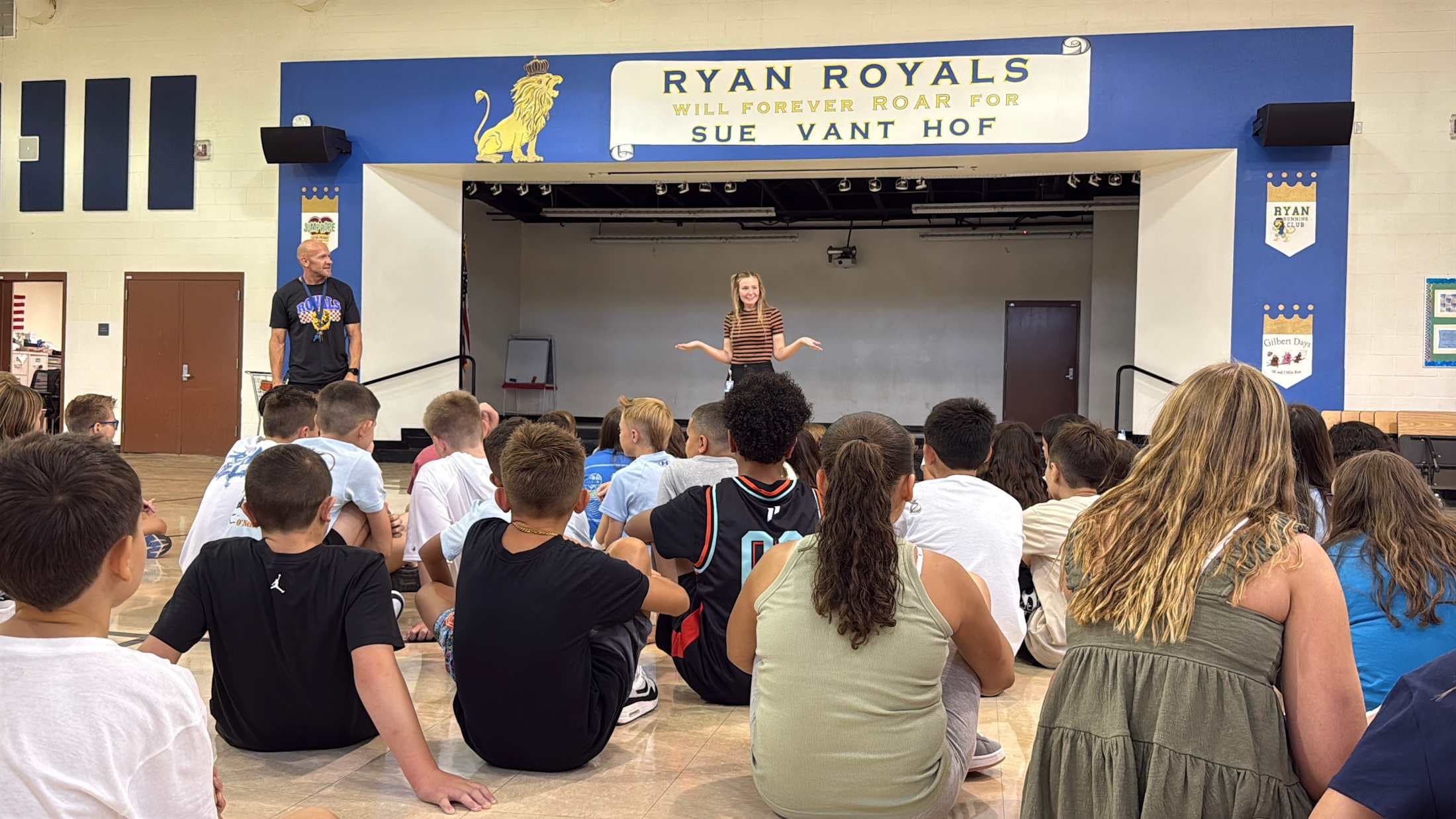 A wide angle of elementary students in their specials class on the first day of school.