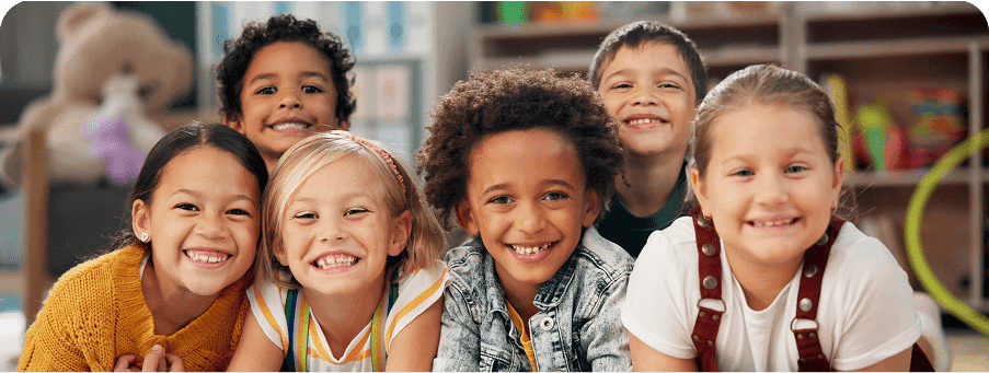 Smiling children posing in a group.