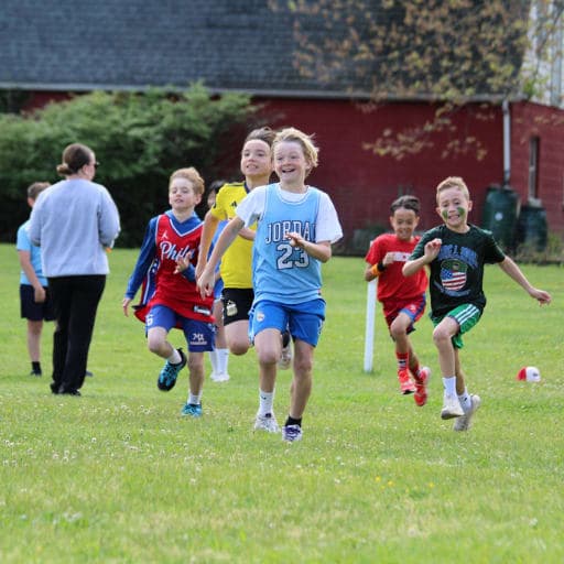 Group of students running at Worcester's 2026 field day