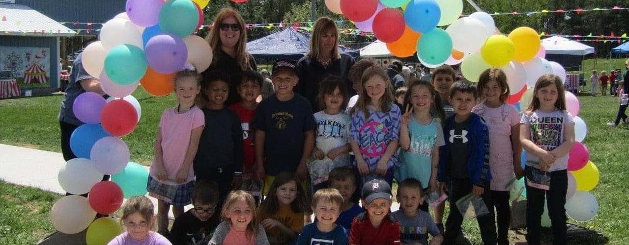 students with balloons
