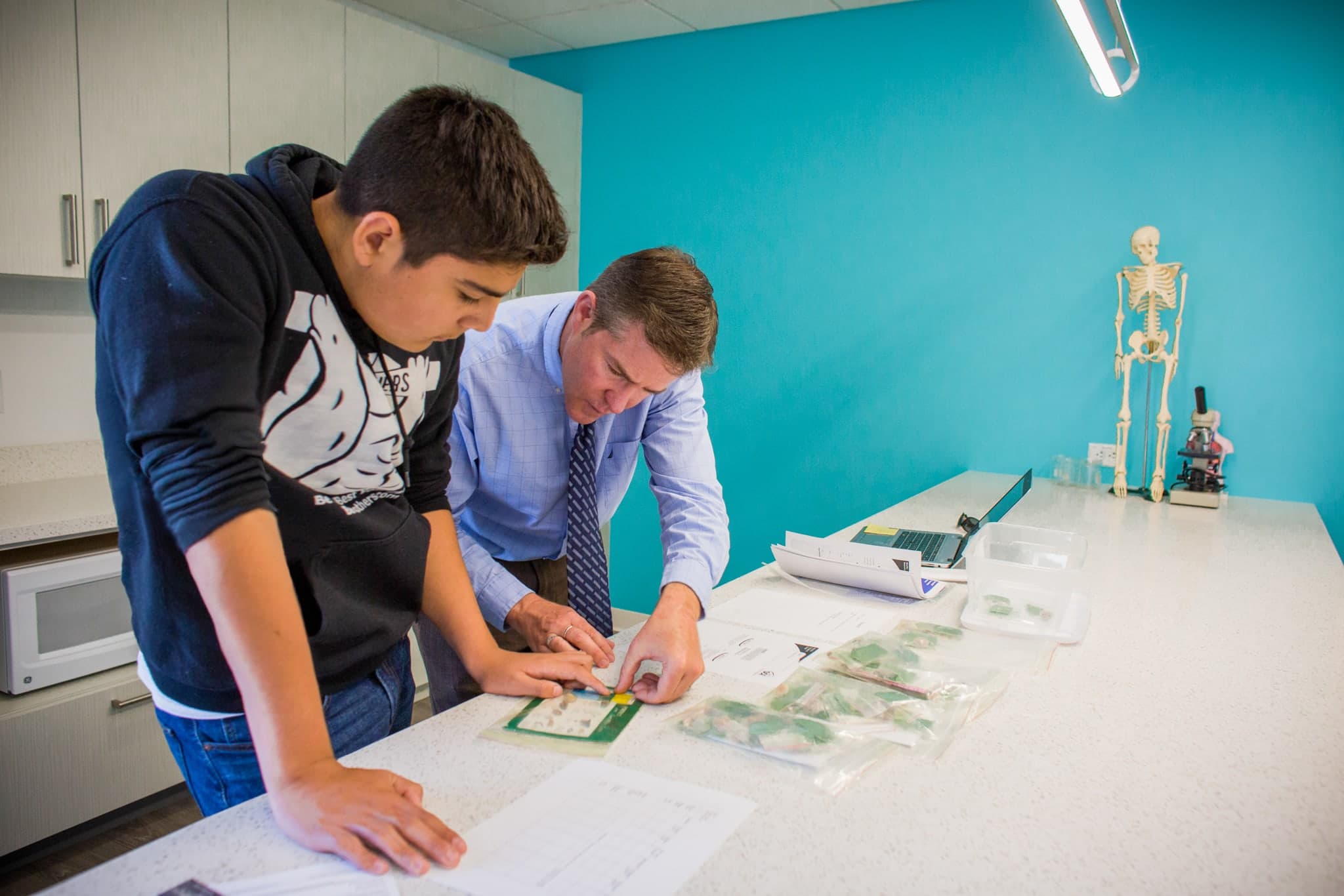 Teacher helping student