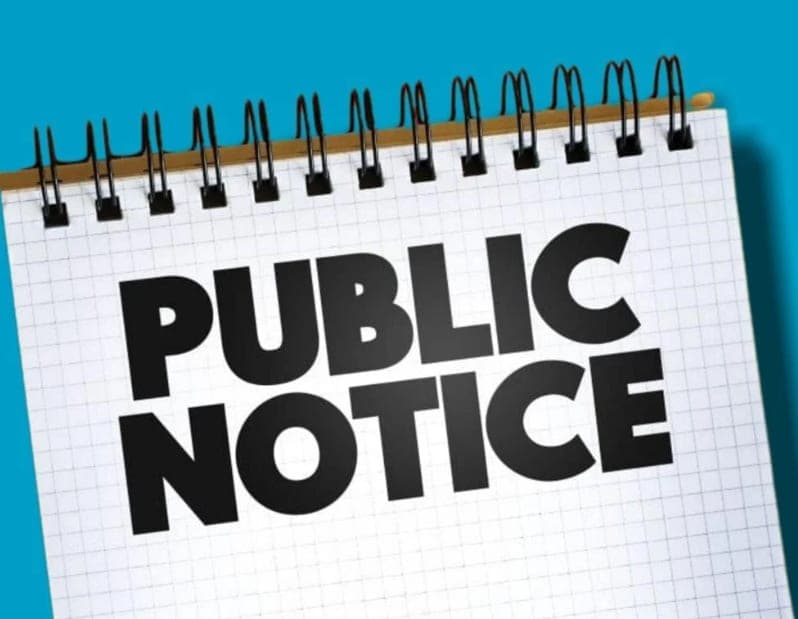 The image shows a spiral-bound notebook with the text "PUBLIC NOTICE" prominently displayed on the page against a bright blue background.