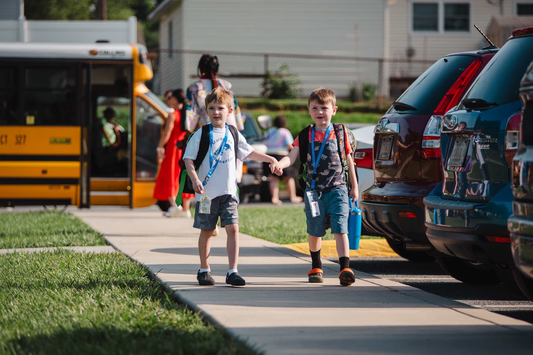 kids walking away from school bus