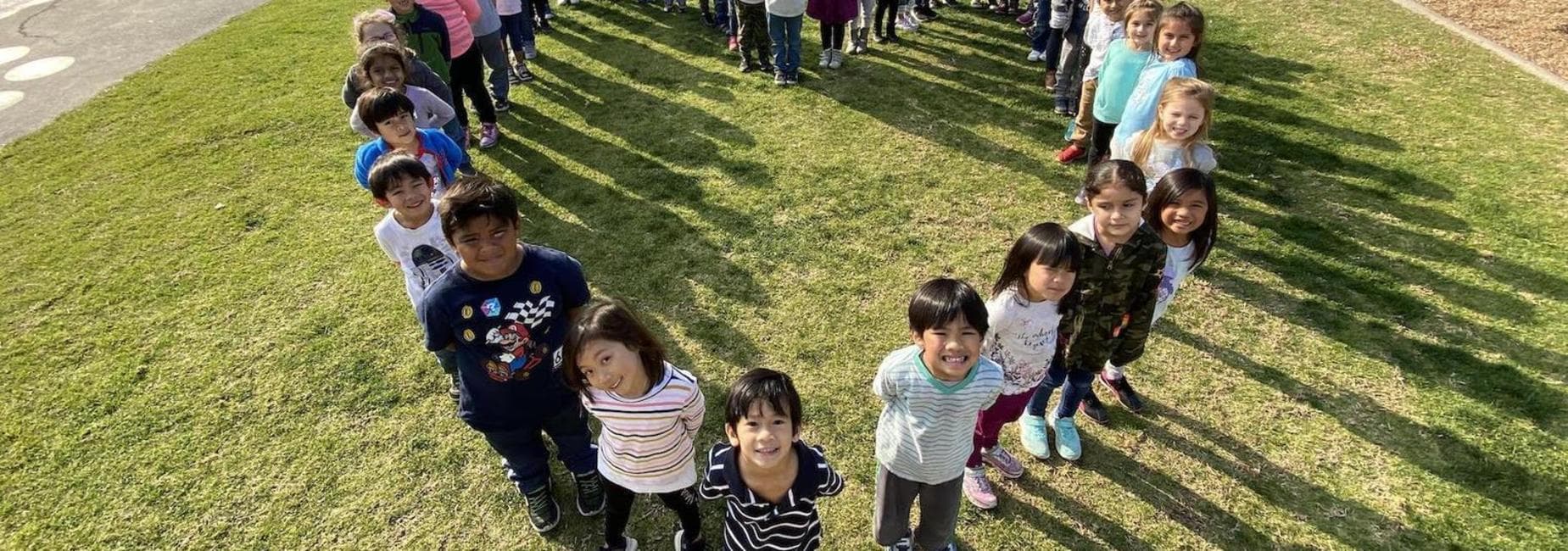students standing in a heart