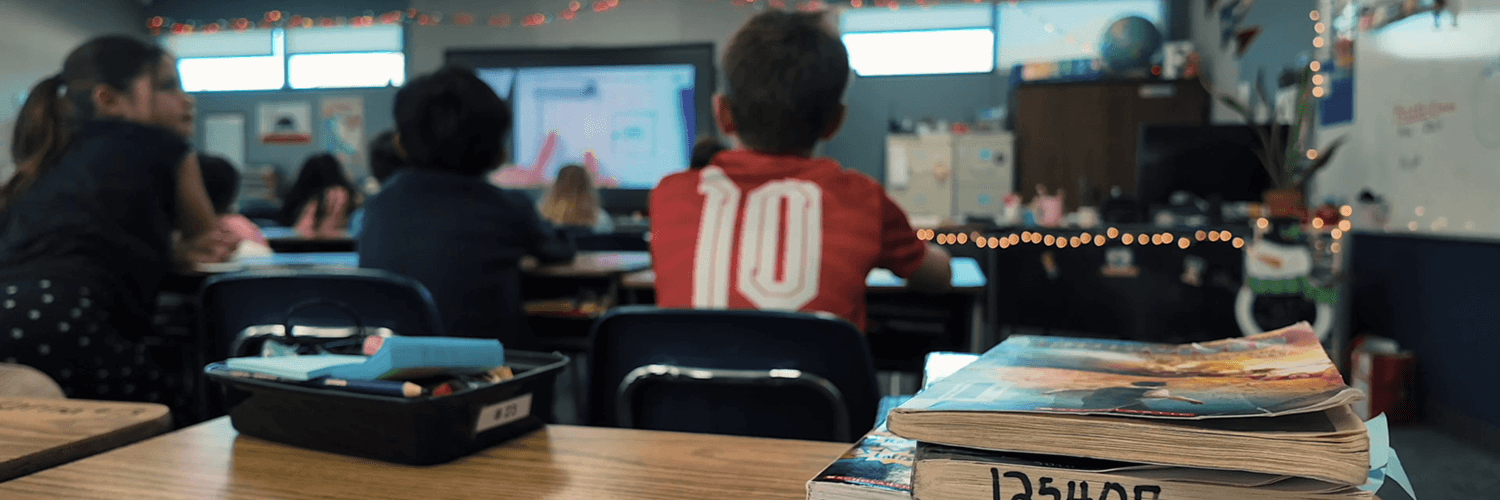 Elementary students watching a classroom presentation