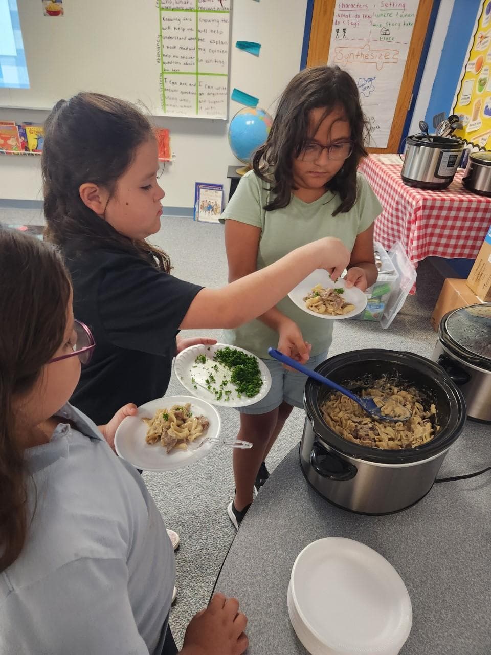 Image captioned on the site as 'Serving up the latest meal from the Crock-Pot class.'