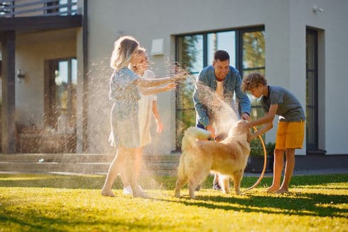 Family Washing Dog