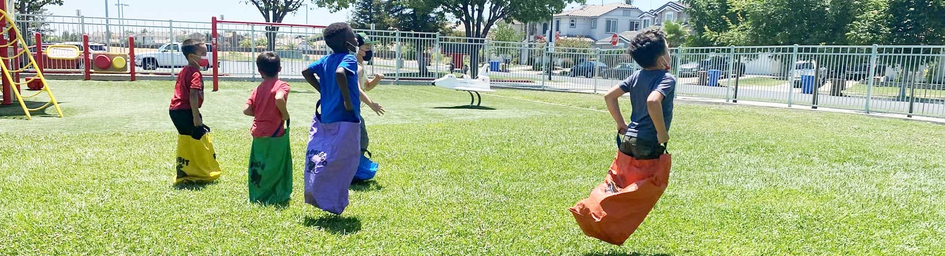 Children participating in a sack race activity.