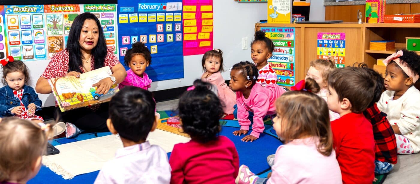 Teacher reading to preschool children.