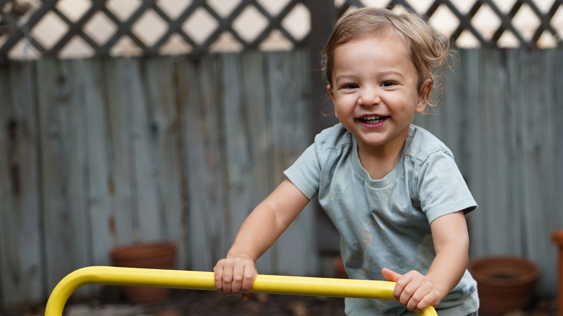 Toddler outside smiling