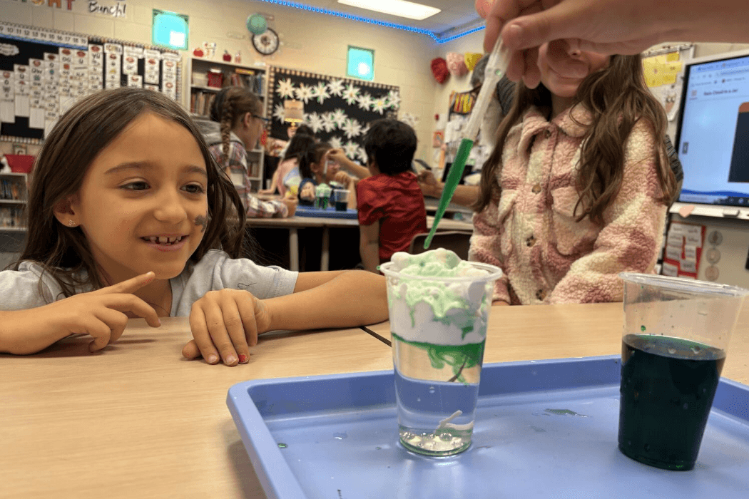 Student watching an experiment.