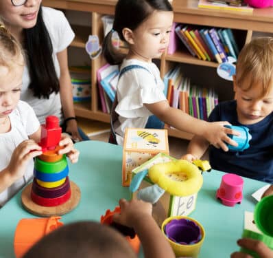 babies playing with their teacher