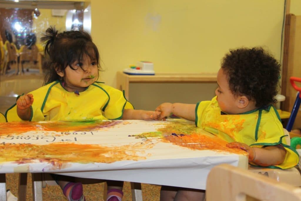 Infant group painting activity.