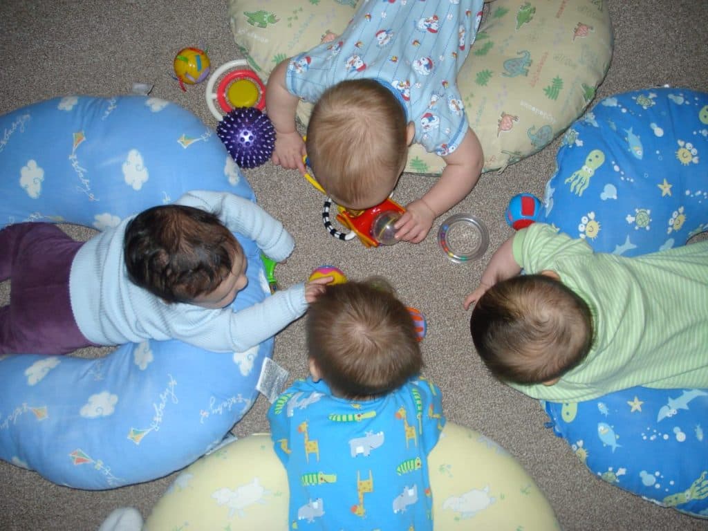 Infants socializing in a classroom.