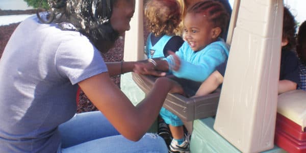 Children playing outside during outdoor time.