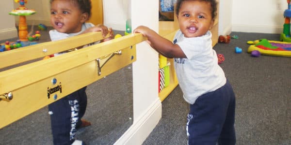 Infant room set up with age-appropriate activities.