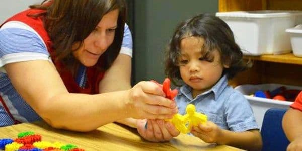 Preschool classroom with a teacher.