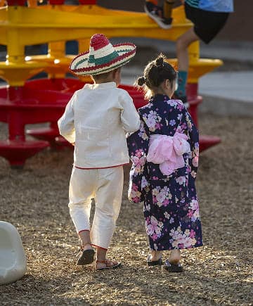 Two kids in cultural attire for Heritage Night at Whittier Elementary School